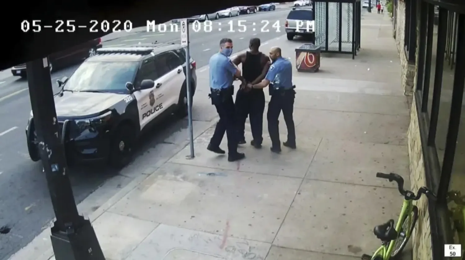 FILE - This image from the video shows Minneapolis police Officers Thomas Lane, left and J. Alexander Kueng, right, escorting George Floyd, center, to a police vehicle outside Cup Foods in Minneapolis, on May 25, 2020. (Court TV via AP, Pool, File)
