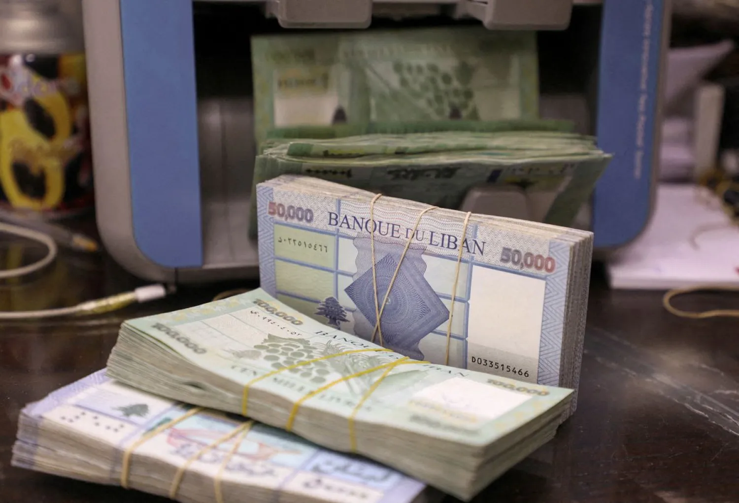 Lebanese pound banknotes are pictured at a currency exchange shop in Beirut, Lebanon, January 5, 2022. (Reuters)