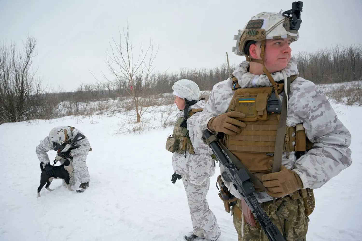Service members of the Ukrainian armed forces are seen at combat positions near the line of separation from Russian-backed rebels outside the town of Avdiivka in Donetsk Region, Ukraine January 25, 2022. (Reuters)