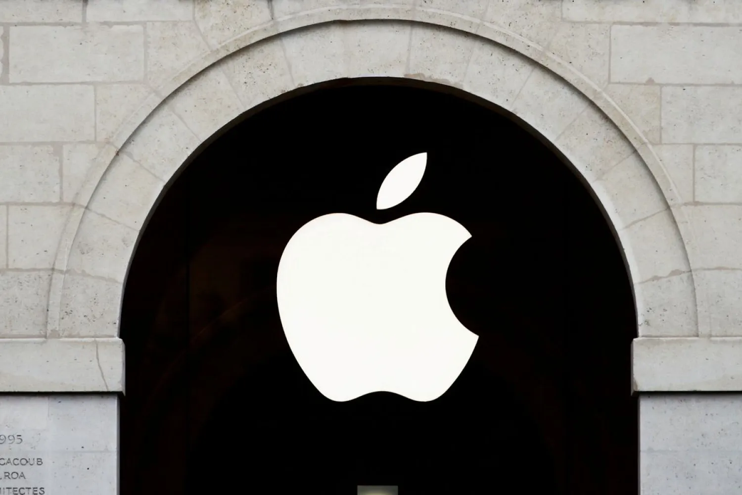Apple logo is seen on the Apple store at The Marche Saint Germain in Paris, France July 15, 2020. REUTERS/Gonzalo Fuentes/File Photo/File Photo