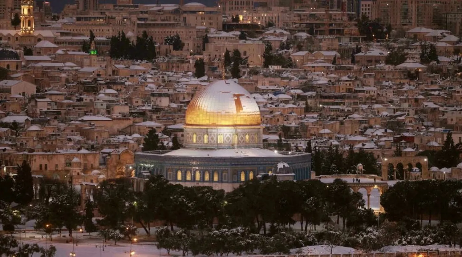 Snow covers Jerusalem's golden-topped Dome of the Rock as rare wintry weather sweeps across the Middle East Menahem KAHANA AFP
