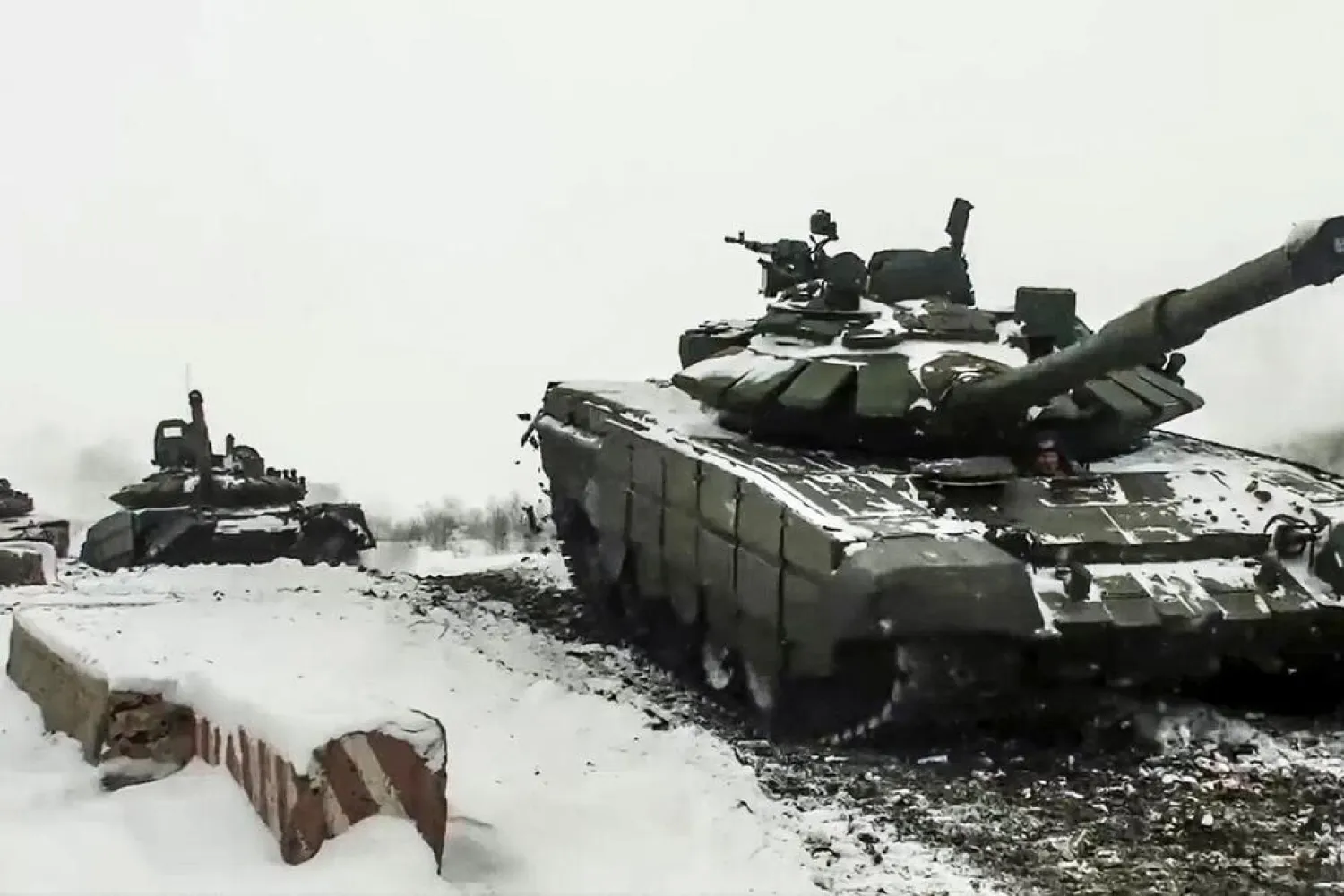 In this photo taken from a video provided by the Russian Defense Ministry Press Service on Wednesday, Jan. 26, 2022,  Russian tanks roll during a military exercise at a training ground in Rostov region, Russia. (Russian Defense Ministry Press Service via AP) THE ASSOCIATED PRESS

