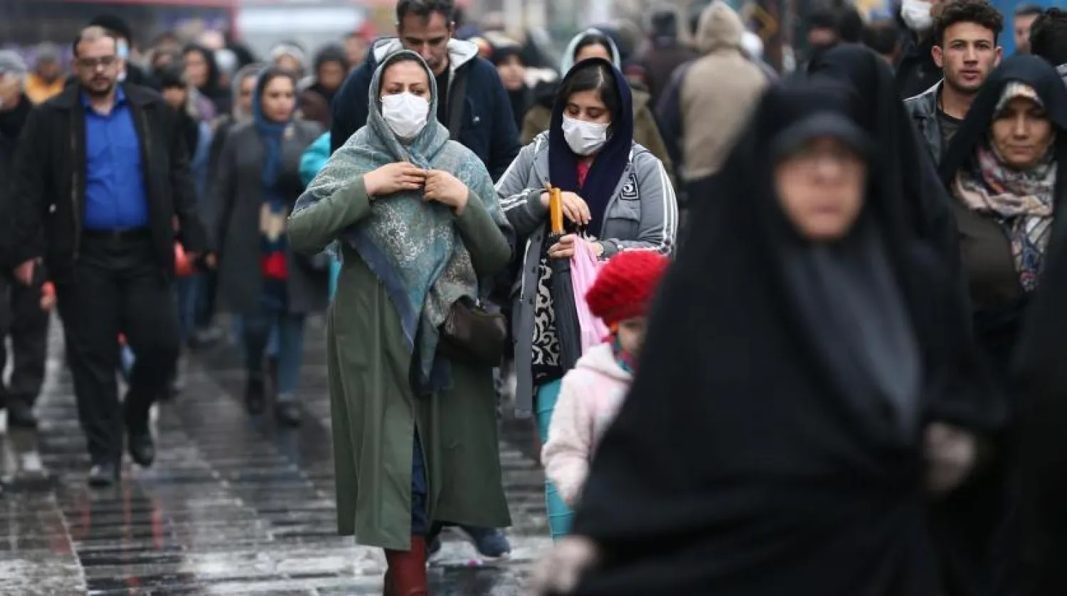 FILE PHOTO: Iranian women wear protective masks to prevent contracting a coronavirus, as they walk at Grand Bazaar in Tehran, Iran February 20, 2020. WANA (West Asia News Agency)/Nazanin Tabatabaee via REUTERS
