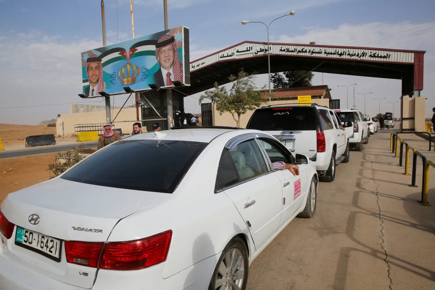 Jordanian police officers check the cars at Jordan's Jaber border crossing, near Syria's Nassib checkpoint, near Mafraq, Jordan, October 25, 2018. REUTERS/Muhammad Hamed