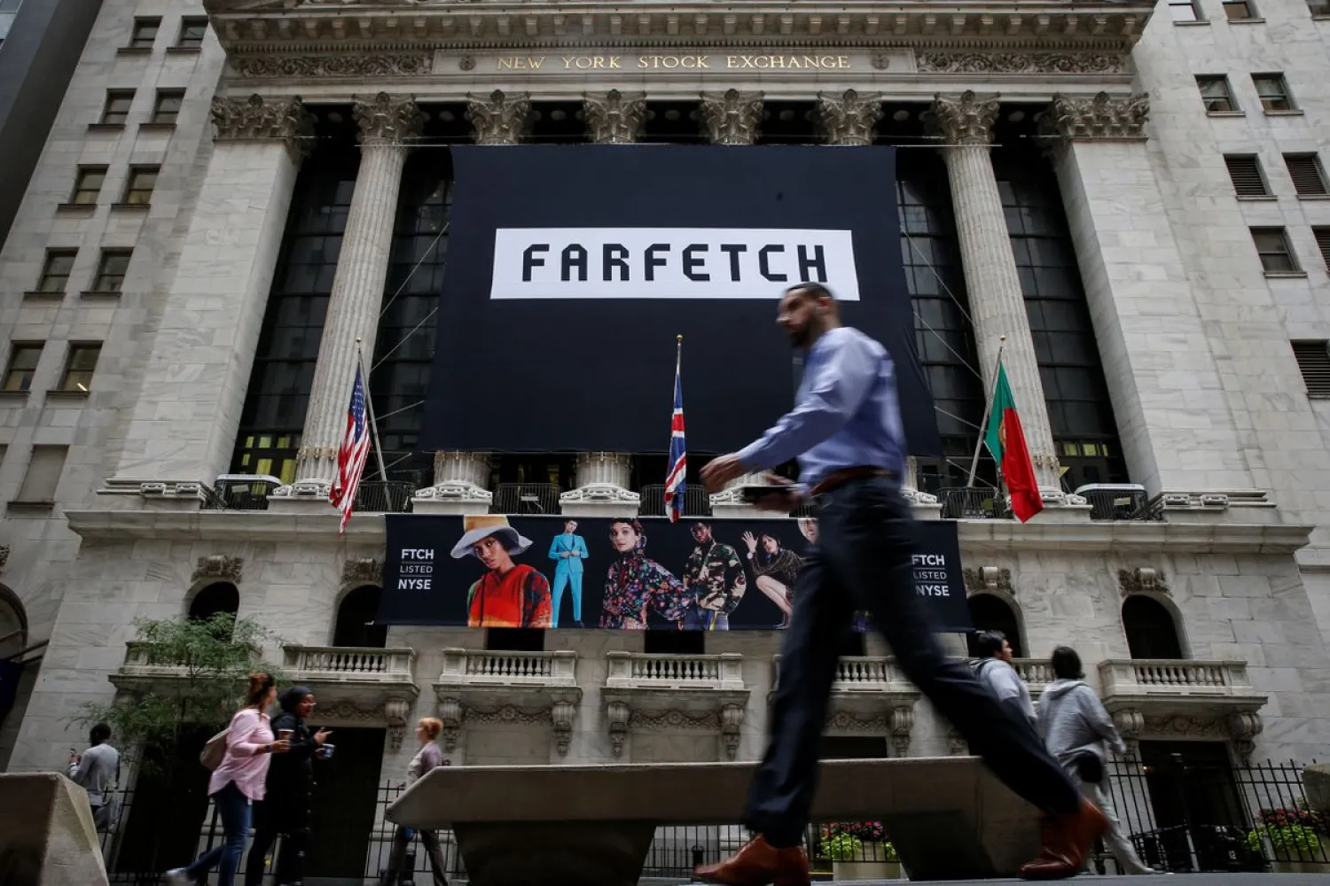 A banner to celebrate the IPO of online fashion house Farfetch is displayed on the facade of the of the New York Stock Exchange (NYSE) in New York, US, September 21, 2018. (Reuters)
