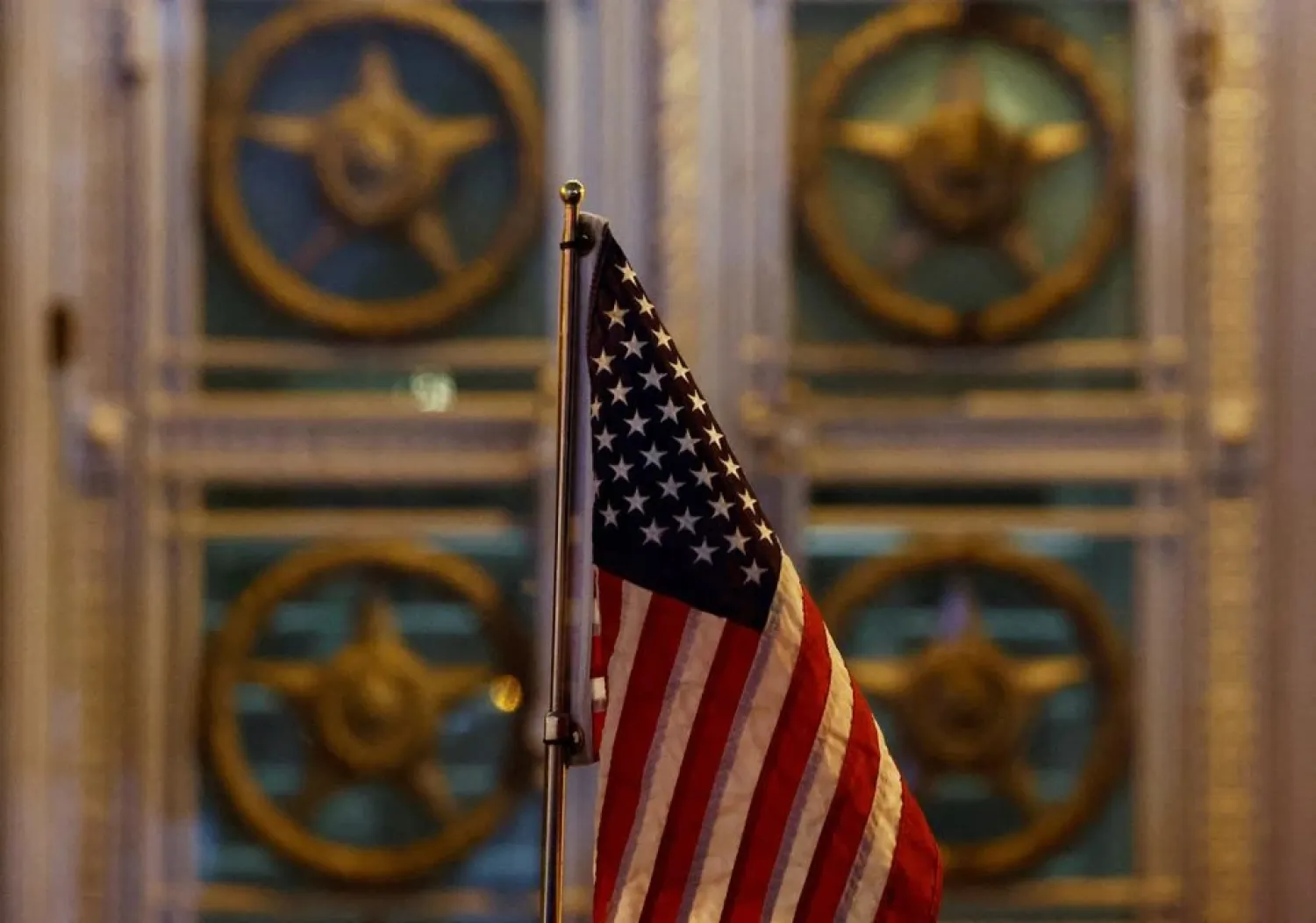A flag is seen on the US delegation's car, which is parked in front of the headquarters of the Russian Foreign Ministry in Moscow, Russia January 26, 2022. (Reuters)