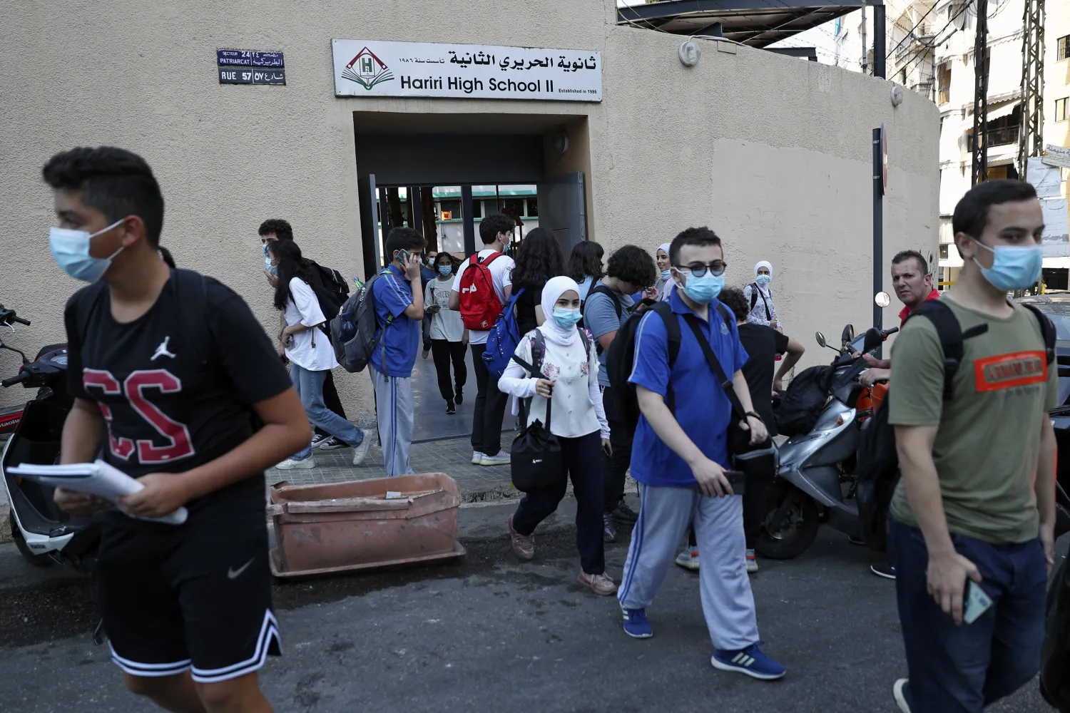 Students leave their school in Beirut, Lebanon, Wednesday, Sept. 29, 2021. (AP Photo/Bilal Hussein)