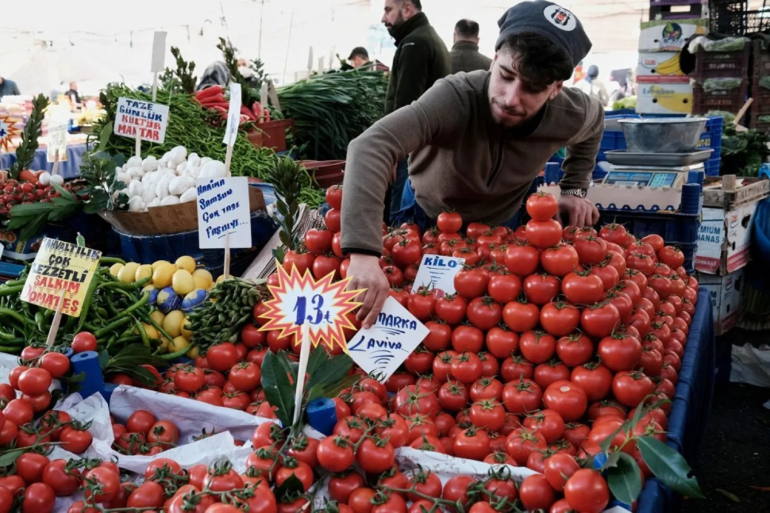 A vendor waits for customers at his stall in a street market in Istanbul, Turkey, January 4, 2022. (Reuters)