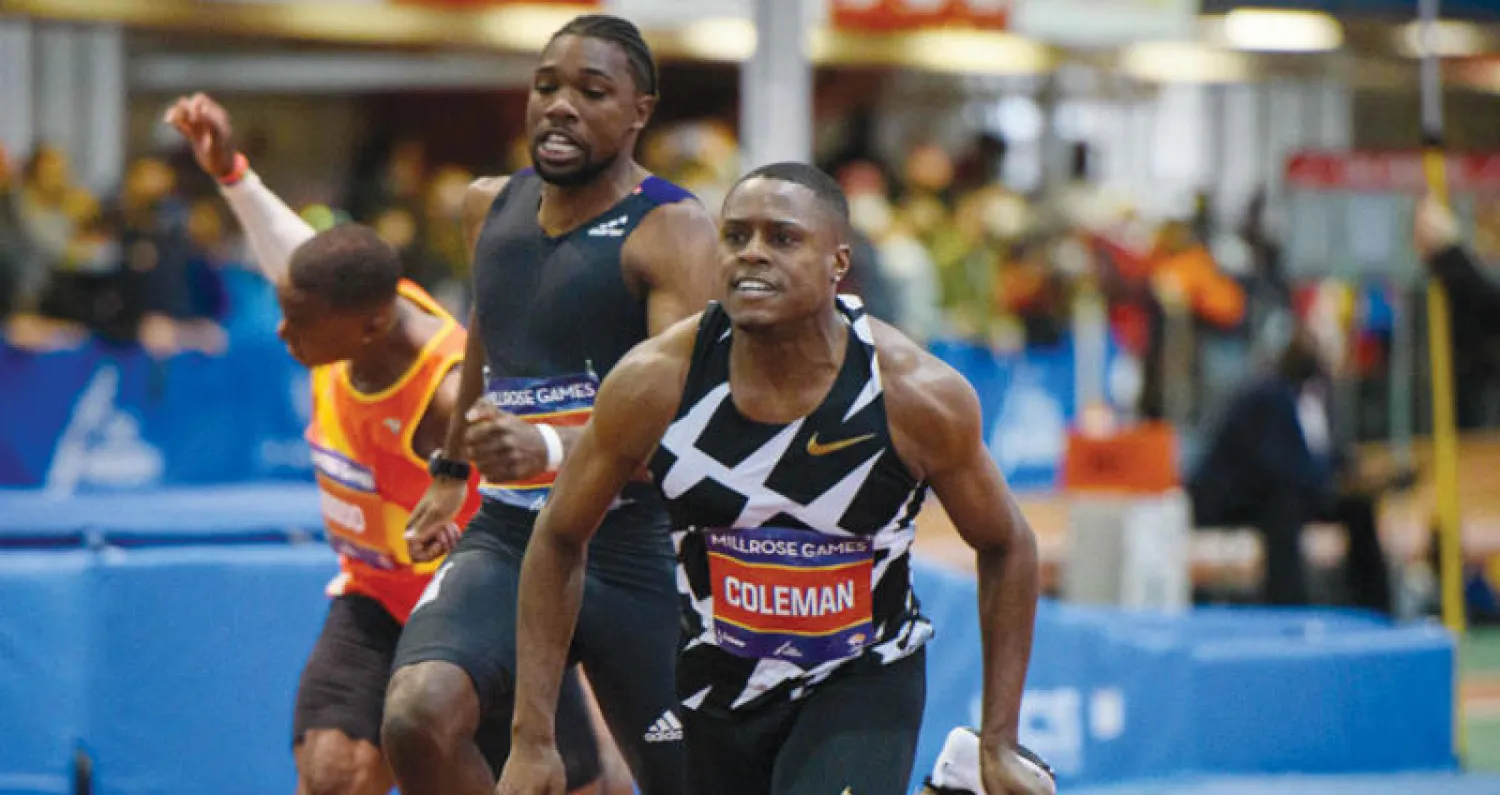 كولمان يتقدم منافسيه في سباق 60 متراً (أ.ف.ب)
