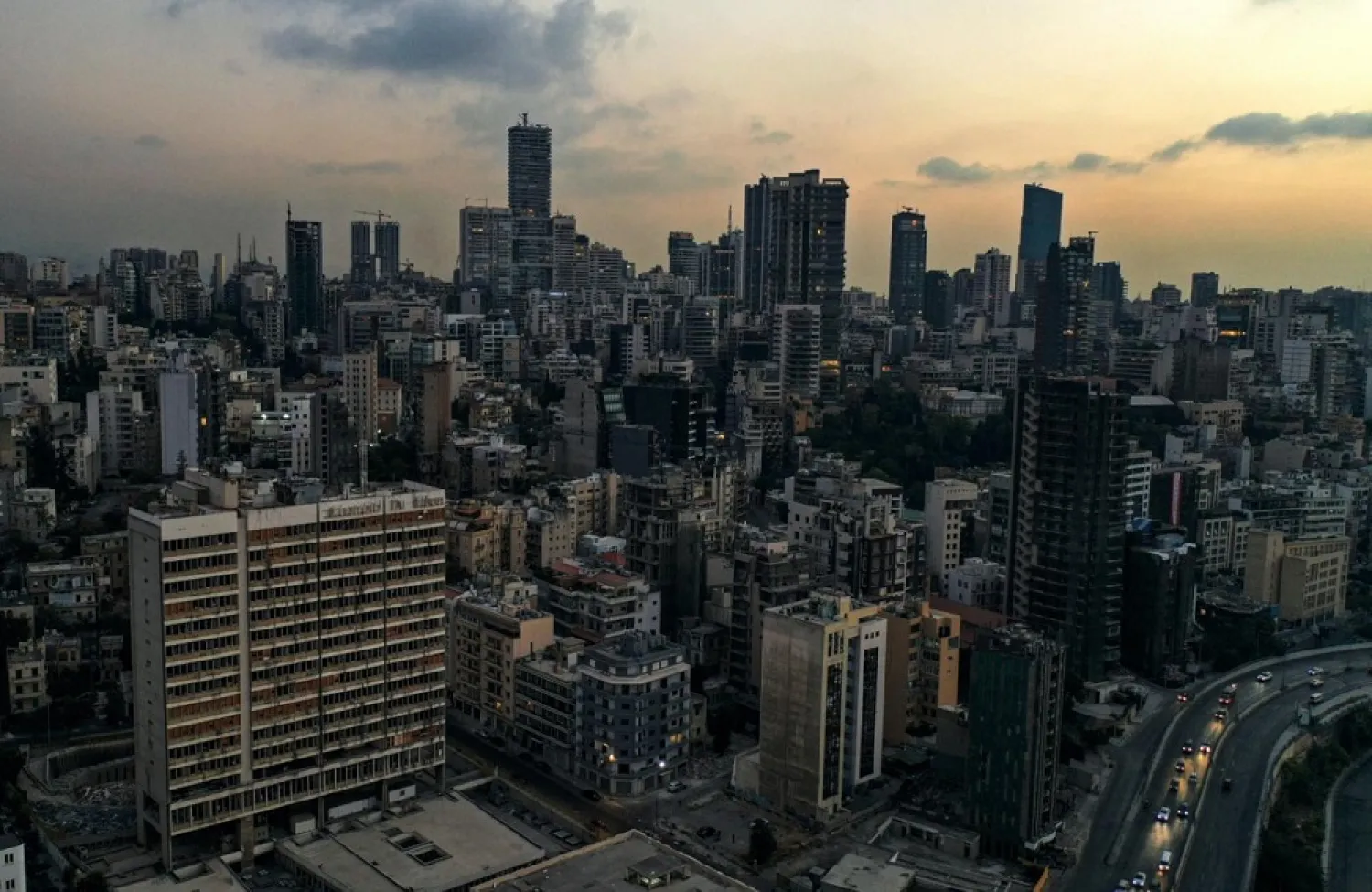 Sunset over the Electricite du Liban building in Beirut during a power outage on October 11, 2021. (AFP)