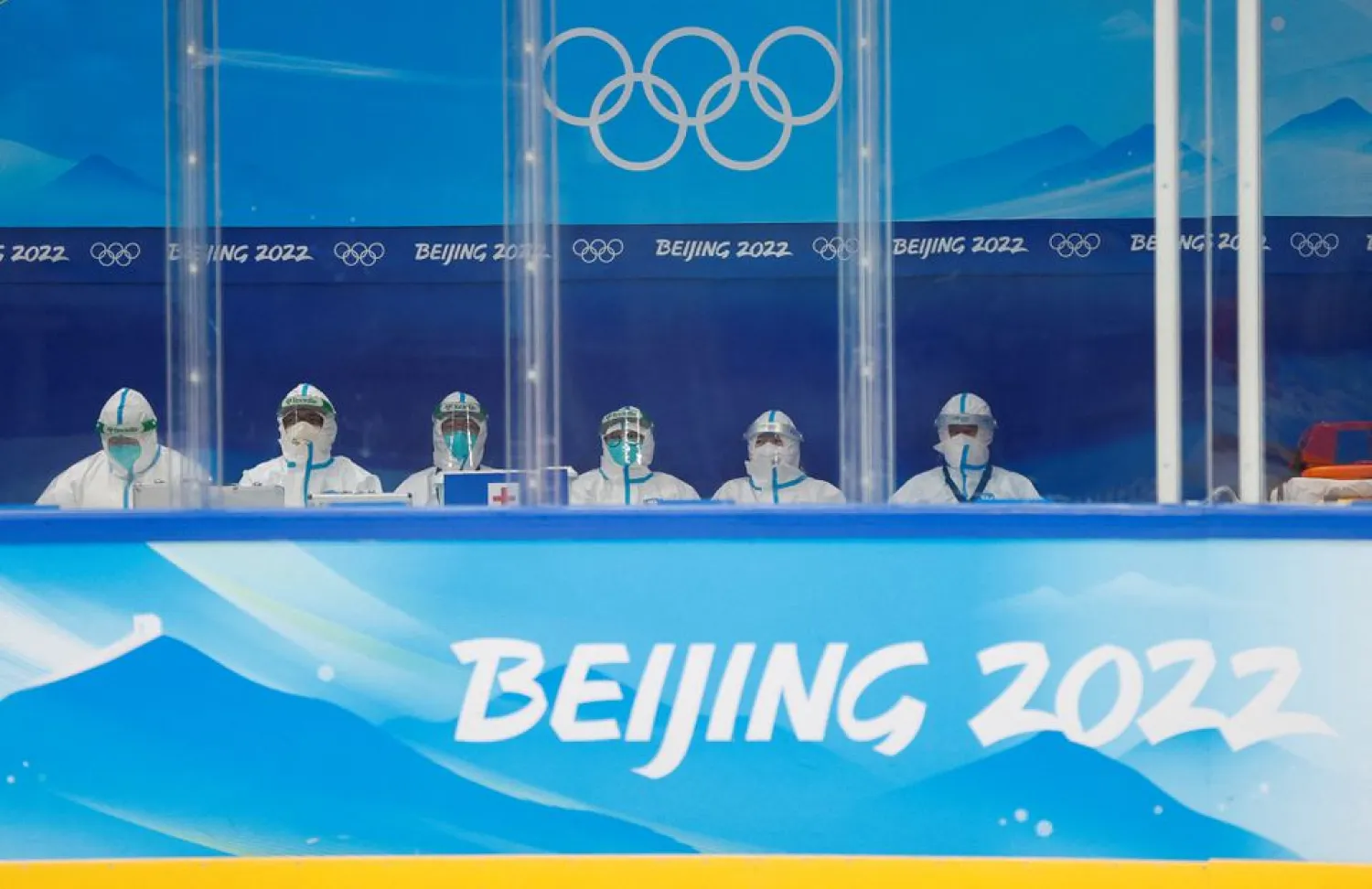 Medical personnel wearing personal protective equipment (PPE) sit rink-side as Czech ice hockey team trains at the National Indoor Stadium ahead of the Beijing 2022 Winter Olympics in Beijing, China, February 1, 2022. (Reuters)