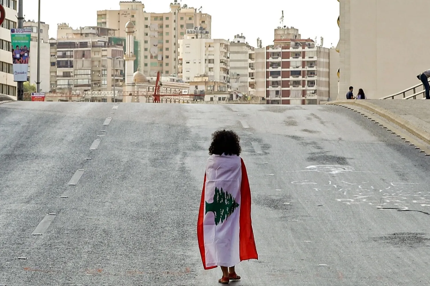  A Lebanese woman walks down Beirut's Fuad Chehab Avenue during anti-government protests on Oct. 29, 2019. (Getty Images)