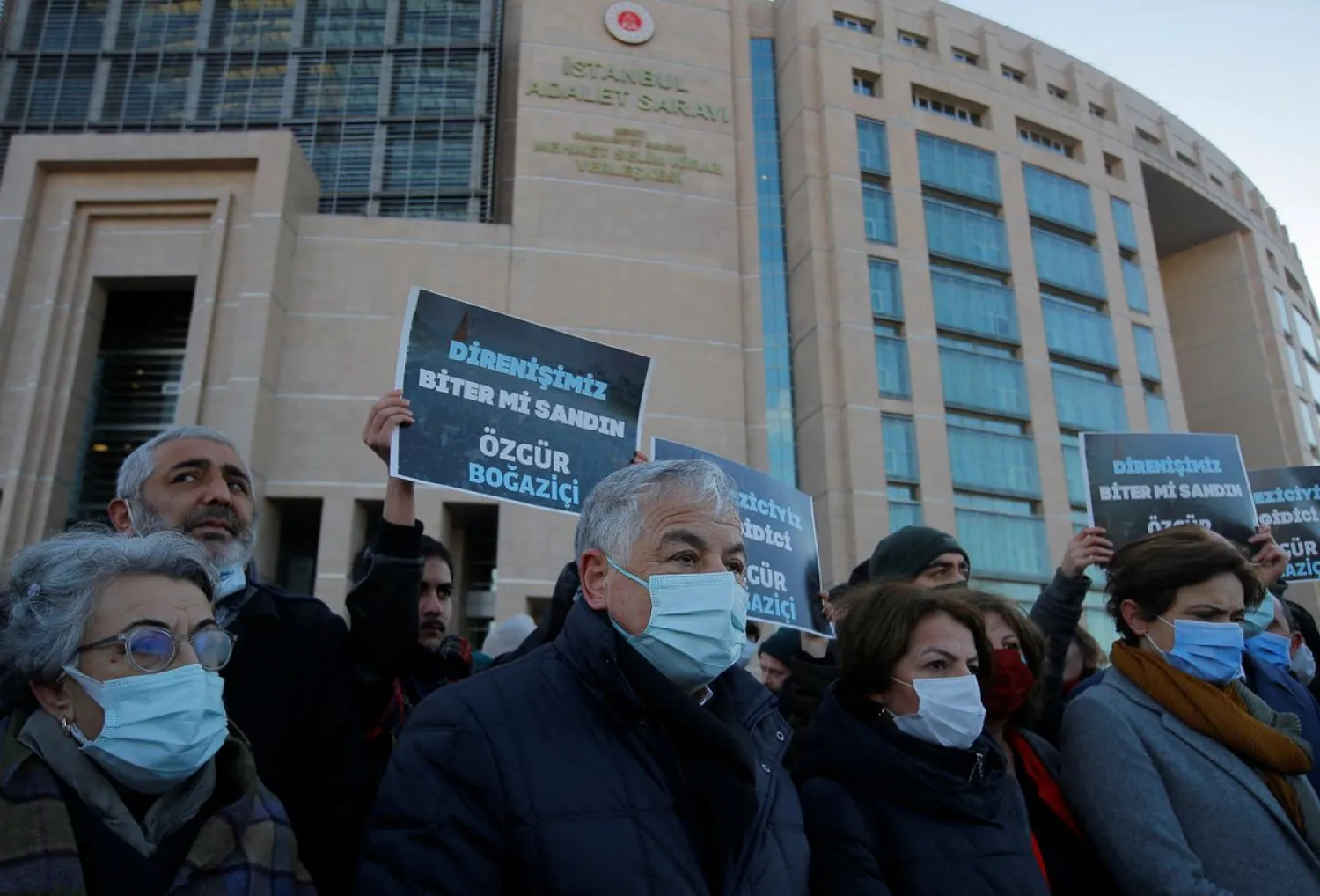 Lawyers, opposition lawmakers and supporters gather in front of the Justice Palace, the Caglayan Courthouse, as a Turkish court holds a hearing of philanthropist Osman Kavala and 15 others over their role in nationwide protests in 2013, in Istanbul, Turkey, January 17, 2022. (Reuters)