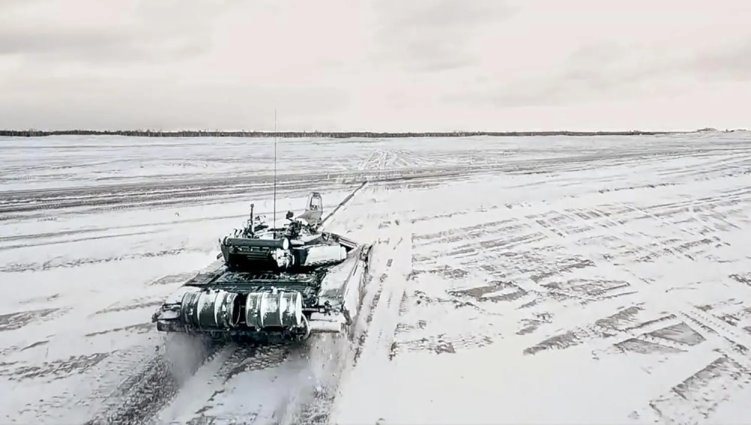 In this photo taken from video and released by the Russian Defense Ministry Press Service on Wednesday, Feb. 2, 2022, a tank drives during a Russian and Belarusian joint military drills at Brestsky firing range. (Russian Defense Ministry Press Service via AP)