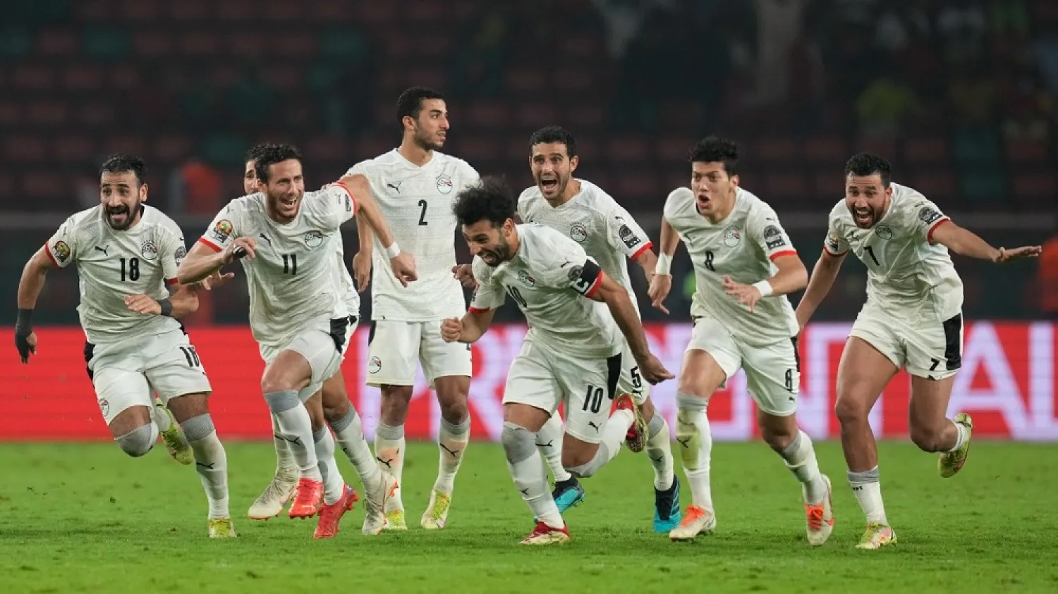 Egypt's Mohamed Salah, center, and teammates celebrate after winning the African Cup of Nations 2022 semifinal against Cameroon at the Olembe stadium in Yaounde, Cameroon, Thursday, Feb. 3, 2022. (AP)