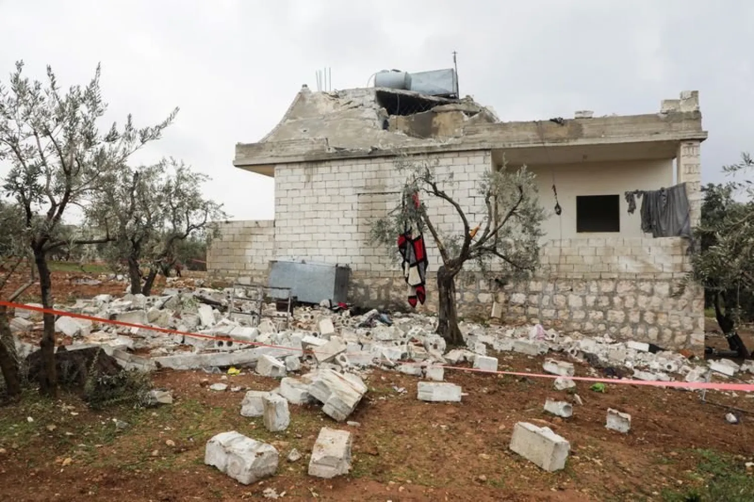 Debris from a building destroyed in the aftermath of a counter-terrorism mission conducted by the US Special Operations Forces is seen in Atmeh, Syria, February 4, 2022. Picture taken with a drone. REUTERS/Mahmoud Hassano


