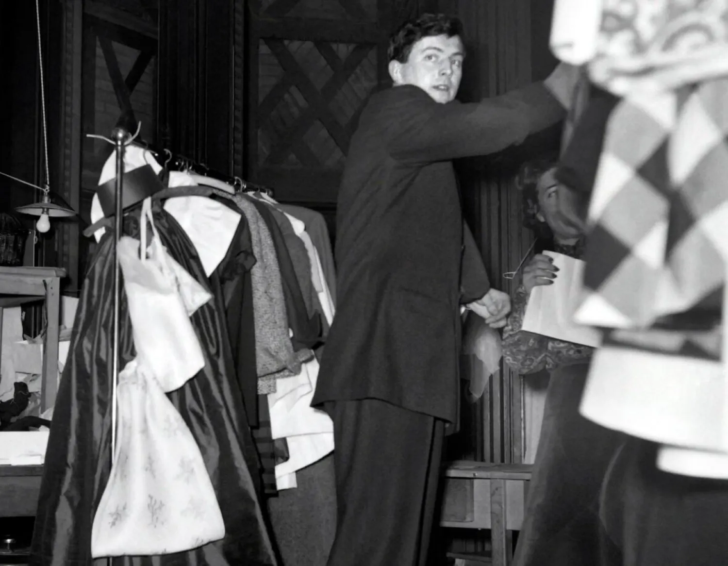 Givenchy waits backstage during the presentation of his 1952 spring/summer collection in Paris on Feb. 2, 1952. (AFP/Getty Images)