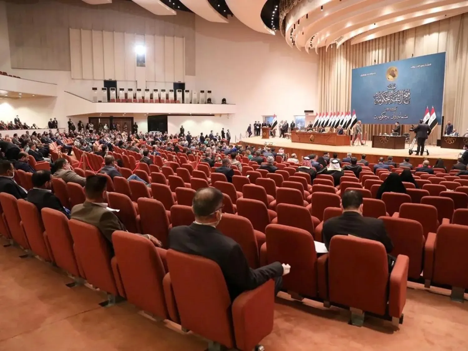 Members of the Iraqi parliament gather before the vote on the new government at the parliament headquarters in Baghdad, May 7, 2020. (Iraqi Parliament Media Office/Handout via Reuters)