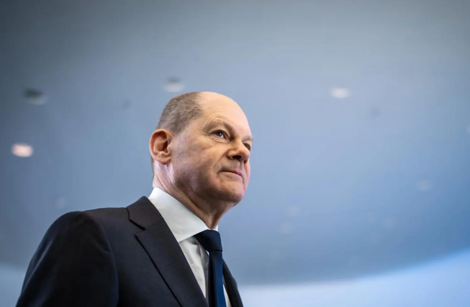 German Chancellor Olaf Scholz leaves after a news conference, ahead of a one-day closed meeting of the German Cabinet at the Chancellery in Berlin, Germany, Friday, Jan. 21, 2022. (AP)
