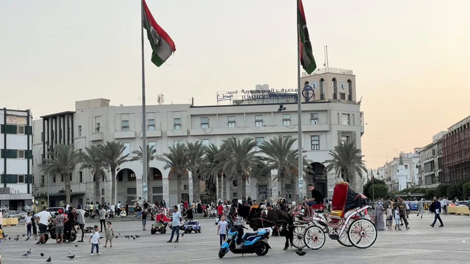 People walk in Martyrs' Square, Tripoli, Libya, September 22, 2021. (Reuters)