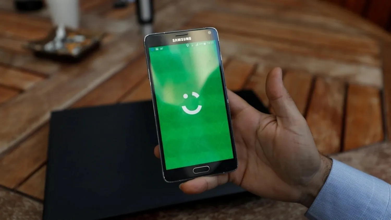  An employee shows the logo of ride-hailing company Careem on his mobile in his office in the West Bank city of Ramallah, July 17, 2017. (Reuters)