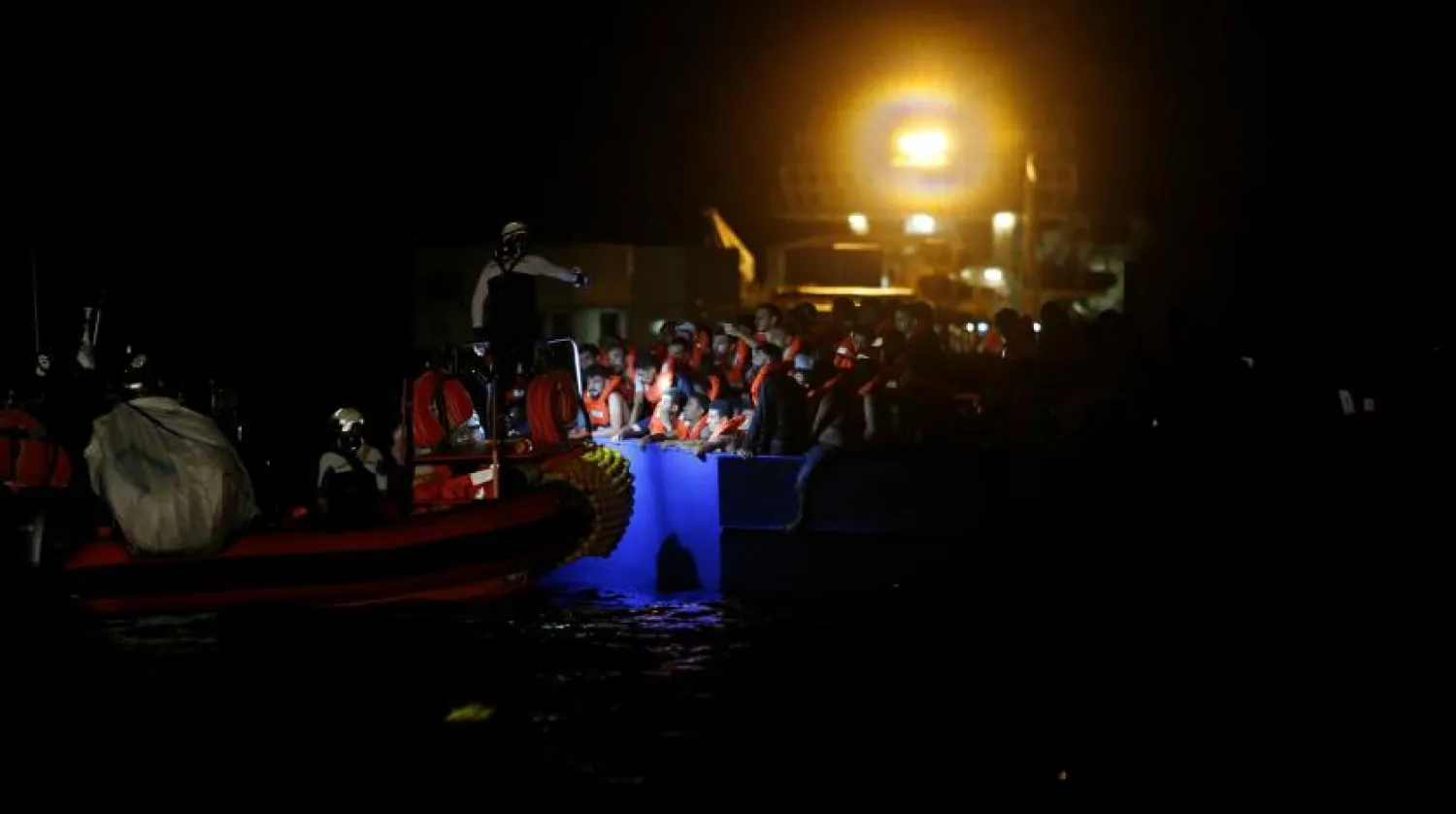 Rescuers pull migrants from aa dangerously overcrowded boat off Tunisia. Reuters file photo

