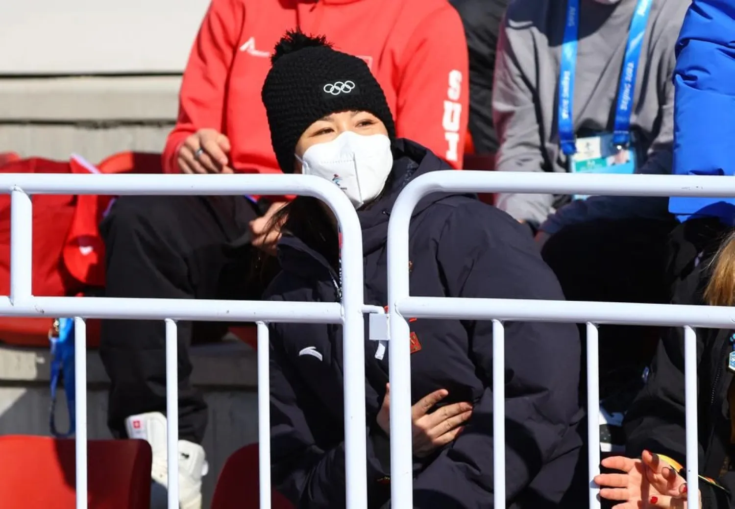 2022 Beijing Olympics - Freestyle Skiing - Women's Freeski Big Air - Final - Run 3 - Big Air Shougang, Beijing, China - February 8, 2022. China's Peng Shuai wearing a face mask watches the event. (Reuters)