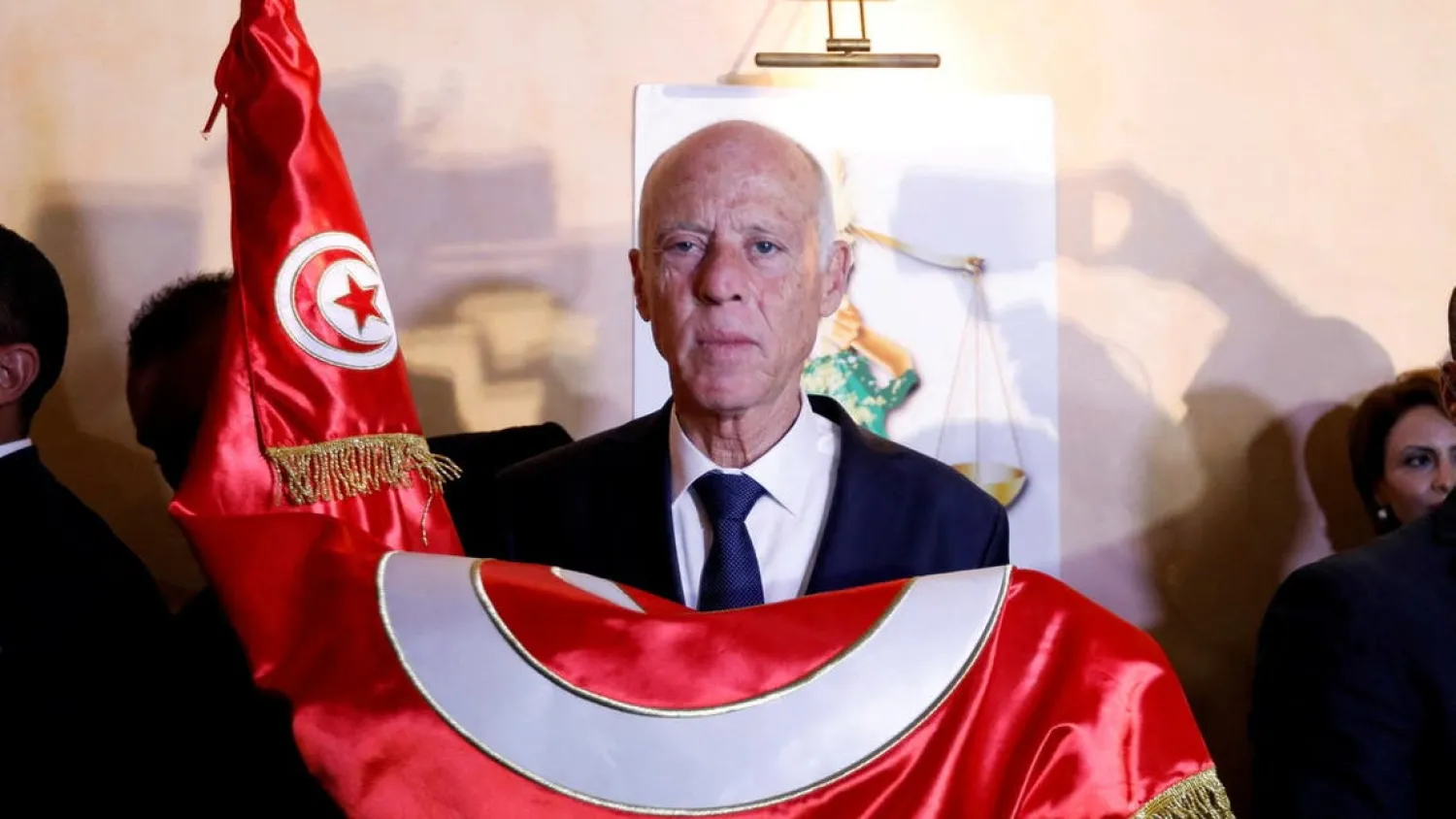 Tunisian presidential candidate Kais Saied reacts after exit poll results were announced in a second round runoff of the presidential election in Tunis, Tunisia October 13, 2019 - Reuters