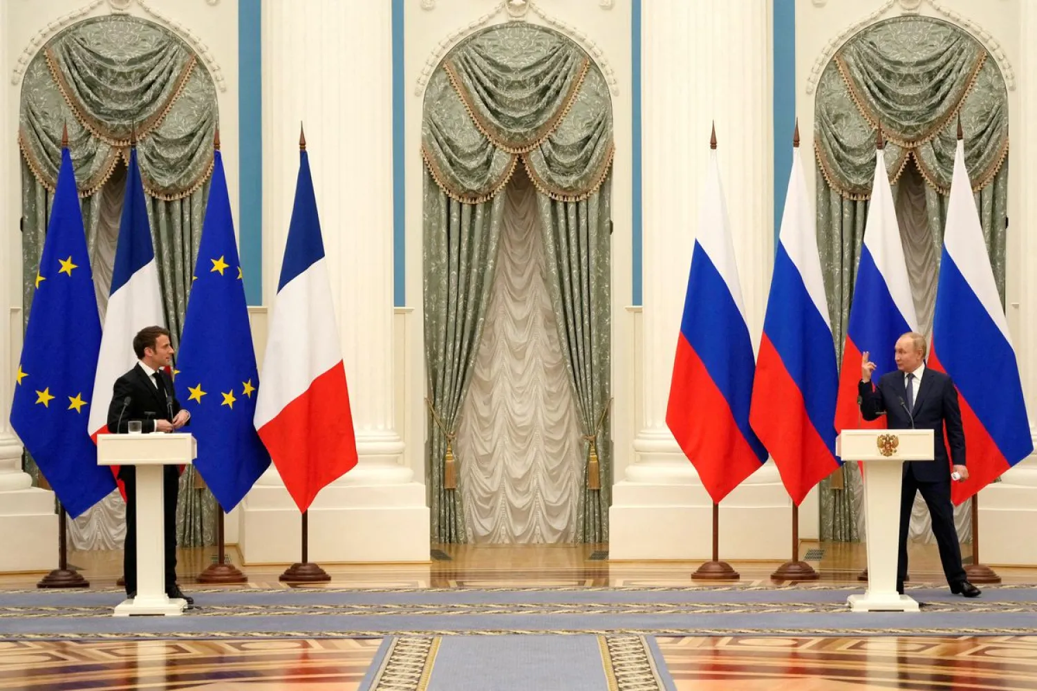Russian President Vladimir Putin and French President Emmanuel Macron, attend a joint press conference, in Moscow, Russia, February 7, 2022. Reuters)
