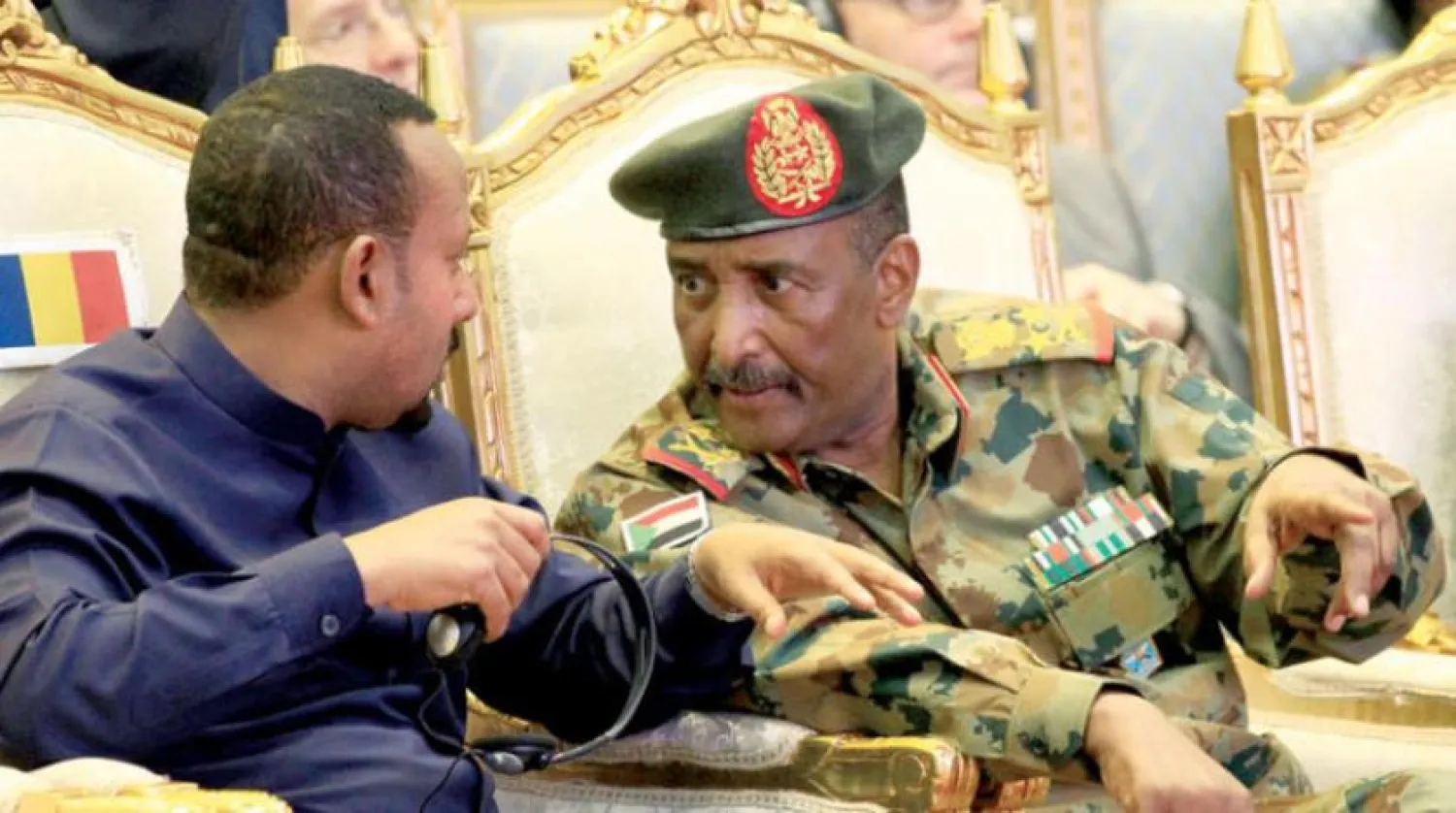  Head of Sudan's Sovereign Transitional Council General Abdel Fattah al-Burhan and Ethiopian Prime Minister Abiy Ahmed during the signing of the “power-sharing” agreement in Khartoum in August 2019.  (Reuters) 