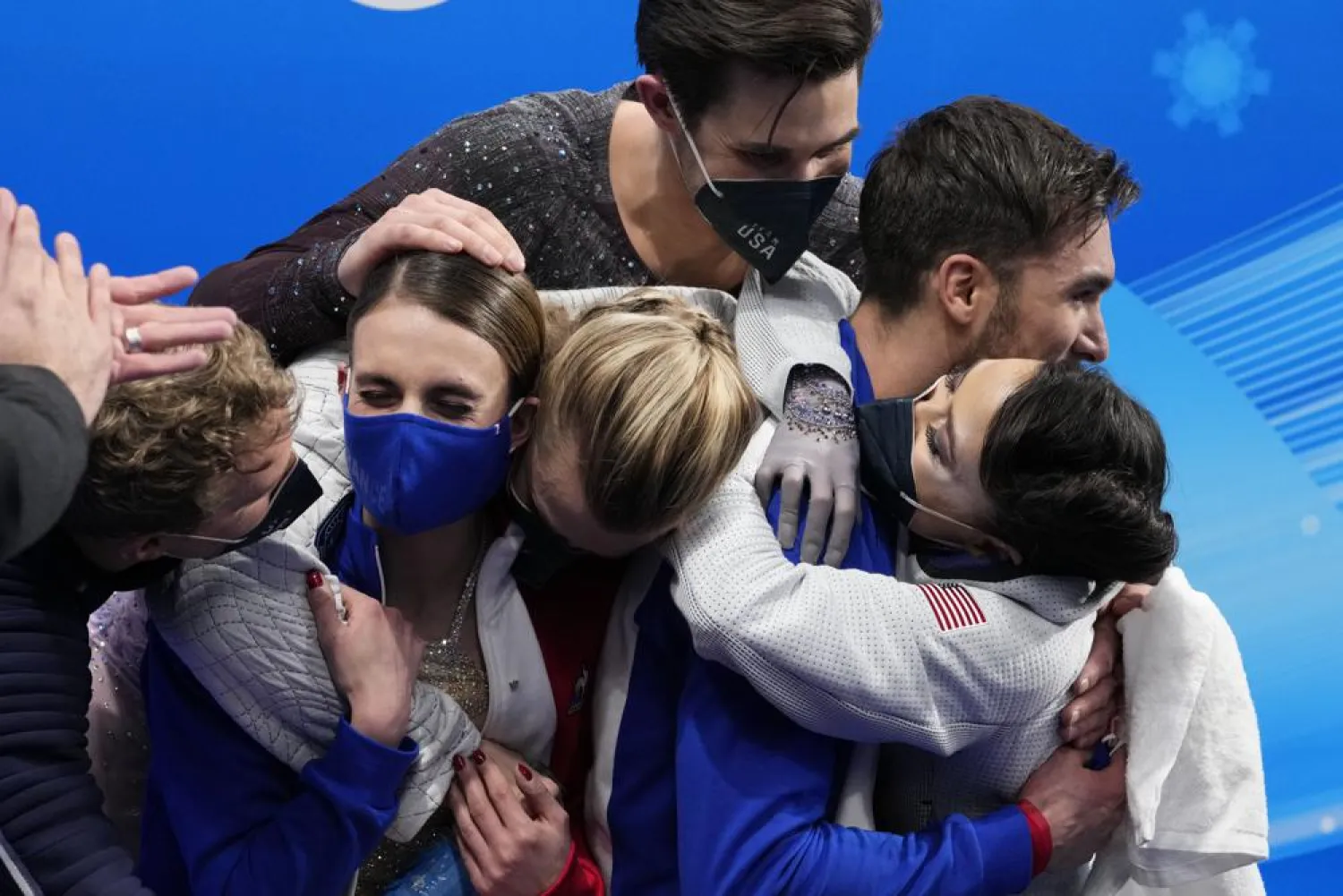 Gabriella Papadakis and Guillaume Cizeron, of France, are congratulated by fellow competitors after winning the gold medal in the ice dance competition during the figure skating at the 2022 Winter Olympics, Monday, Feb. 14, 2022, in Beijing. (AP)