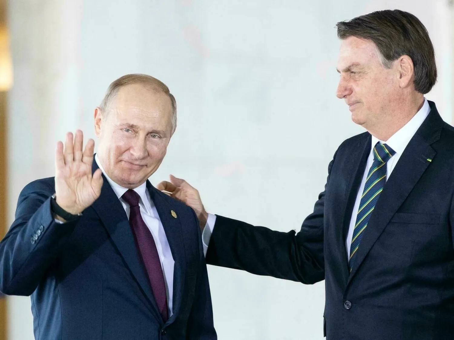 Russian President Vladimir Putin greets his Brazilian counterpart Jair Bolsonaro on November 14 2019 at a BRICS summit in Brasilia. Pavel Golovkin POOL/AFP/File

