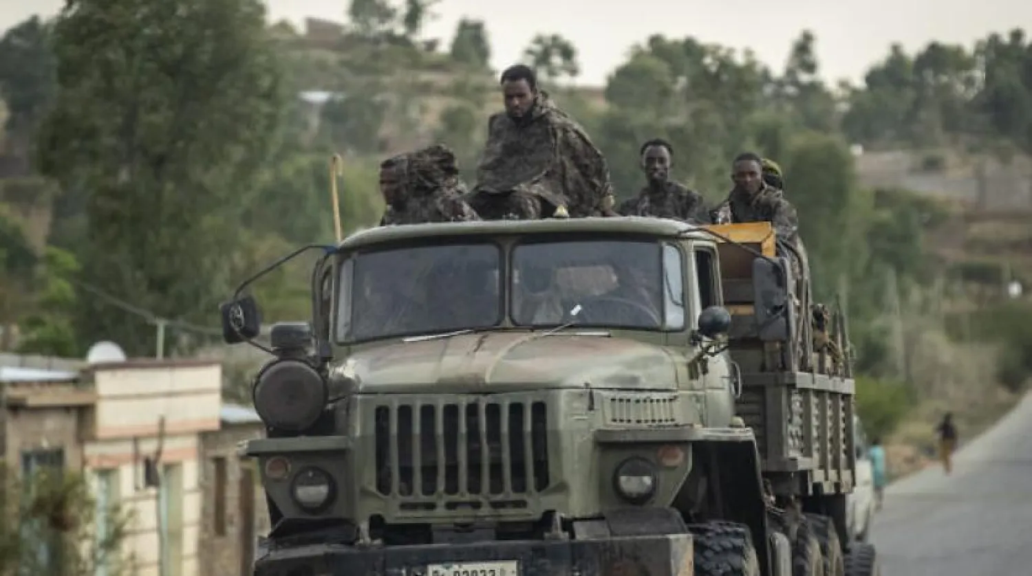 Ethiopian government soldiers ride in the back of a truck on a road leading to Abi Adi, in the Tigray region of northern Ethiopia, on May 11, 2021. (AP Photo/Ben Curtis, File)
