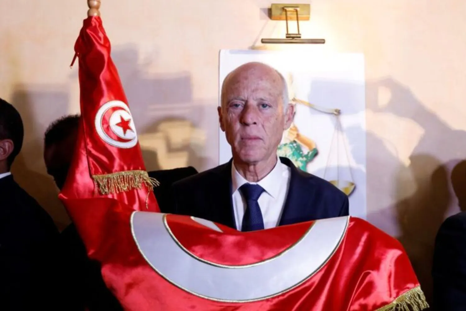 Tunisian presidential candidate Kais Saied reacts after exit poll results were announced in a second round runoff of the presidential election in Tunis, Tunisia October 13, 2019. (Reuters)