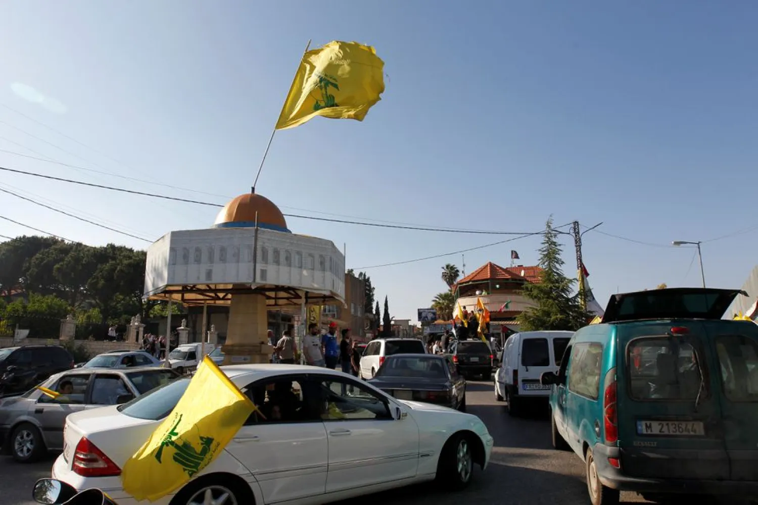 Hezbollah flag flies over a replica of Jerusalem's Dome of the Rock during a protest to express solidarity with the Palestinian people, in Kfar Kila near the border with Israel, southern Lebanon, May 14, 2021. REUTERS/Aziz Taher