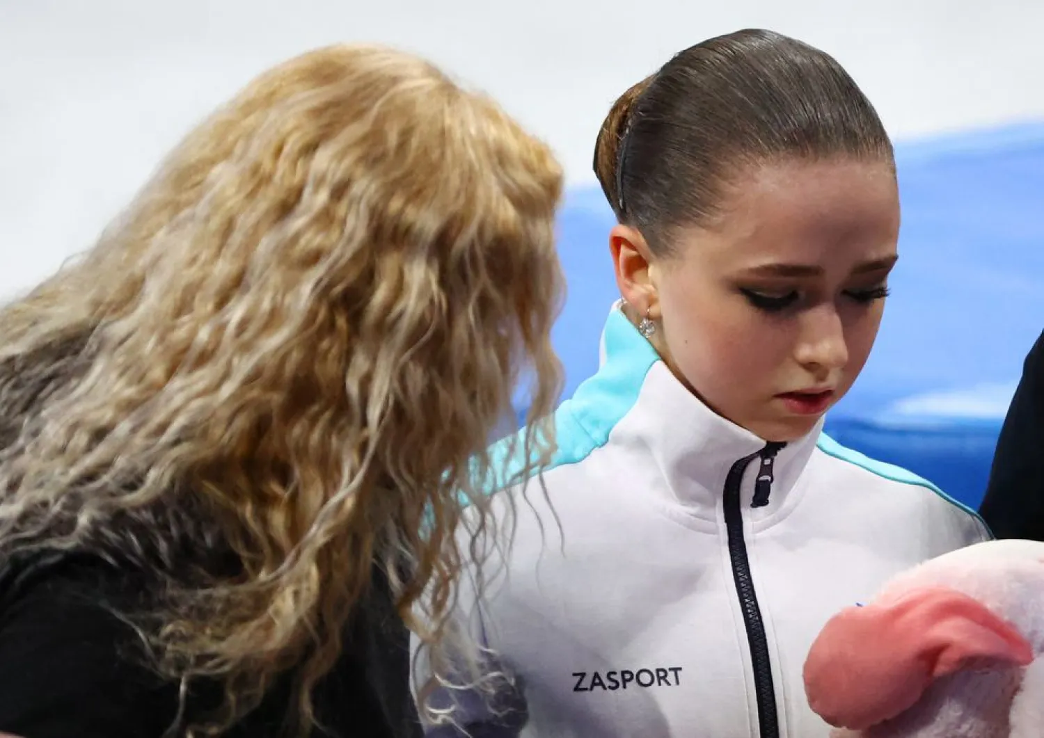 Kamila Valieva of the Russian Olympic Committee reacts after competing with coach Eteri Tutberidze of the Russian Olympic Committee, February 17, 2022. (Reuters)