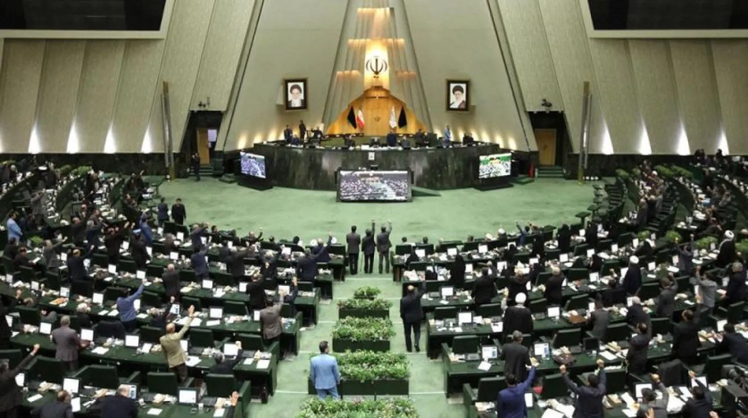 Iranian lawmakers raise their hands to vote during a parliamentary session in Tehran, on January 7, 2020. (Getty Images)
