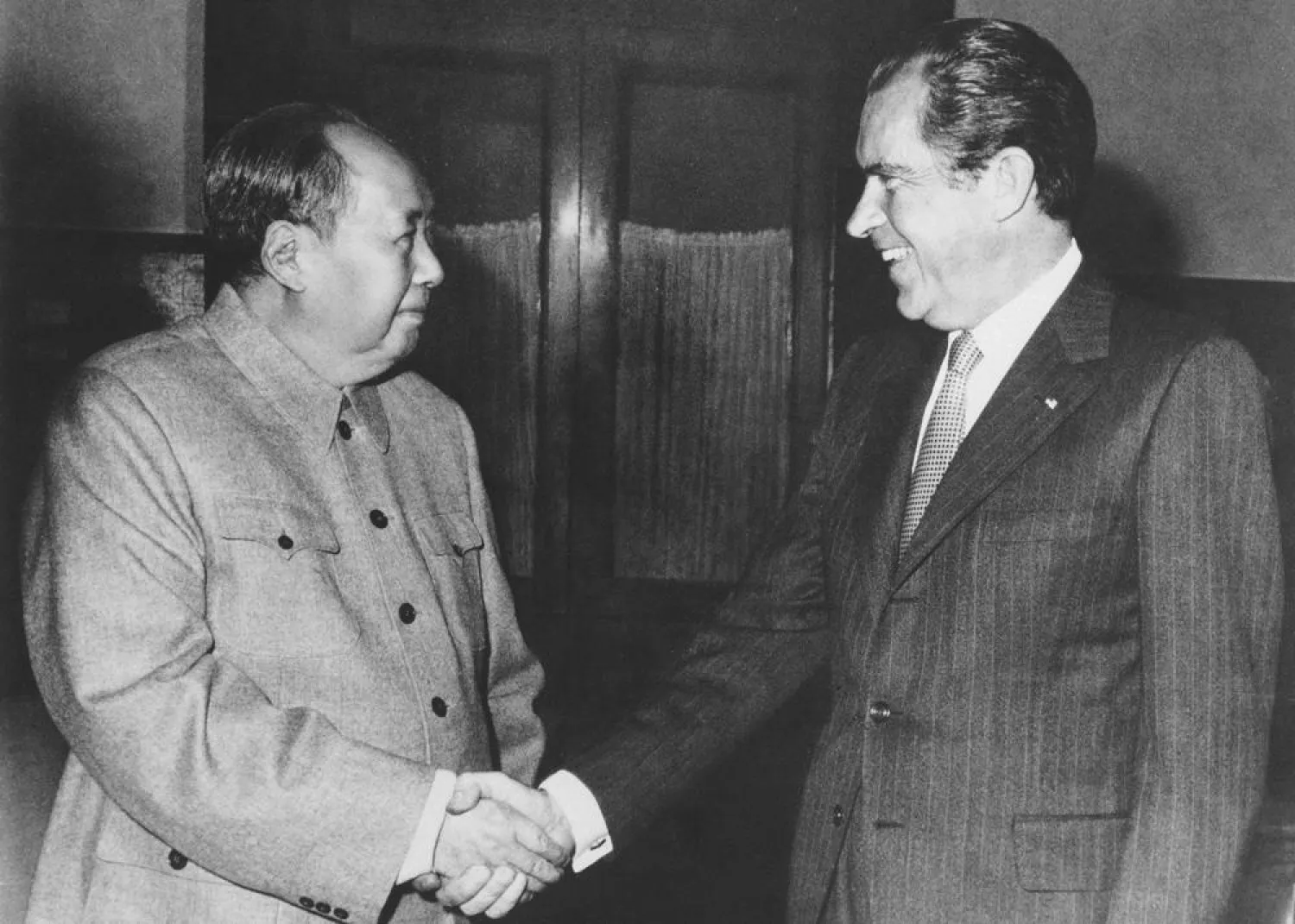 FILE - Then Chinese communist party leader Mao Zedong, left, and then US President Richard Nixon shake hands as they meet in Beijing on Feb. 21, 1972. At the height of the Cold War, US President Richard Nixon flew into communist China's center of power for a visit that over time would transform US-China relations and China's position in the world in ways that were unimaginable at the time. (AP Photo, File)
