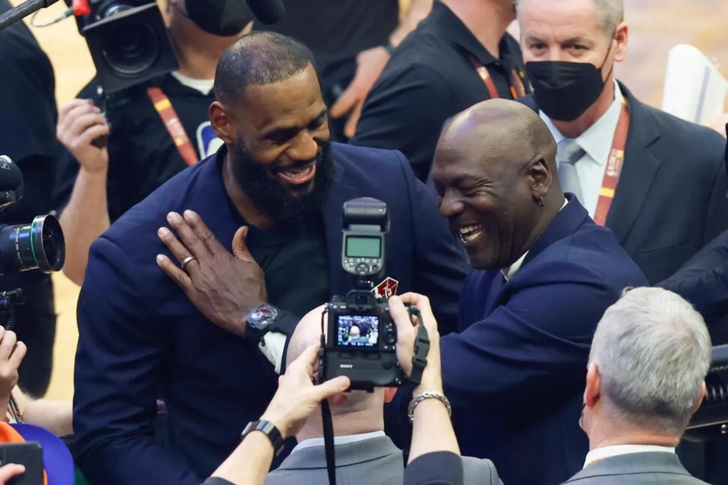 Los Angeles Lakers' LeBron James, left, and former NBA great Michale Jordan greet each other during the introduction of 75 of the leagues greatest player during halftime at the NBA All-Star basketball game, Sunday, Feb. 20, 2022, in Cleveland. (AP)