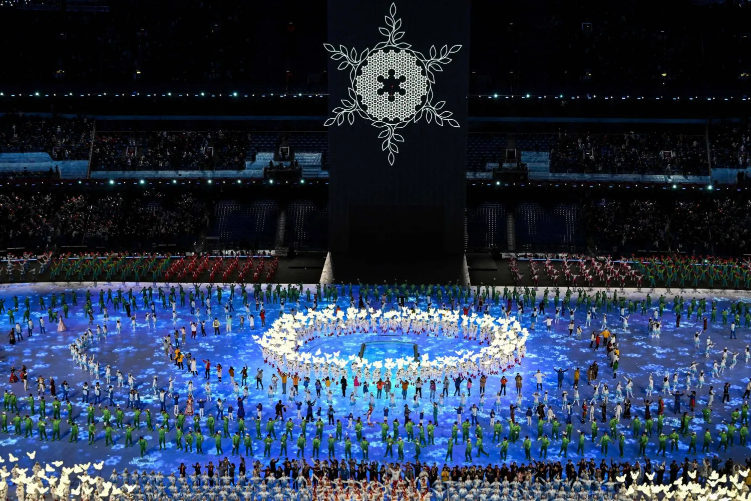 Performers dance during the opening ceremony of the Beijing Games on Friday. | AFP-JIJI
