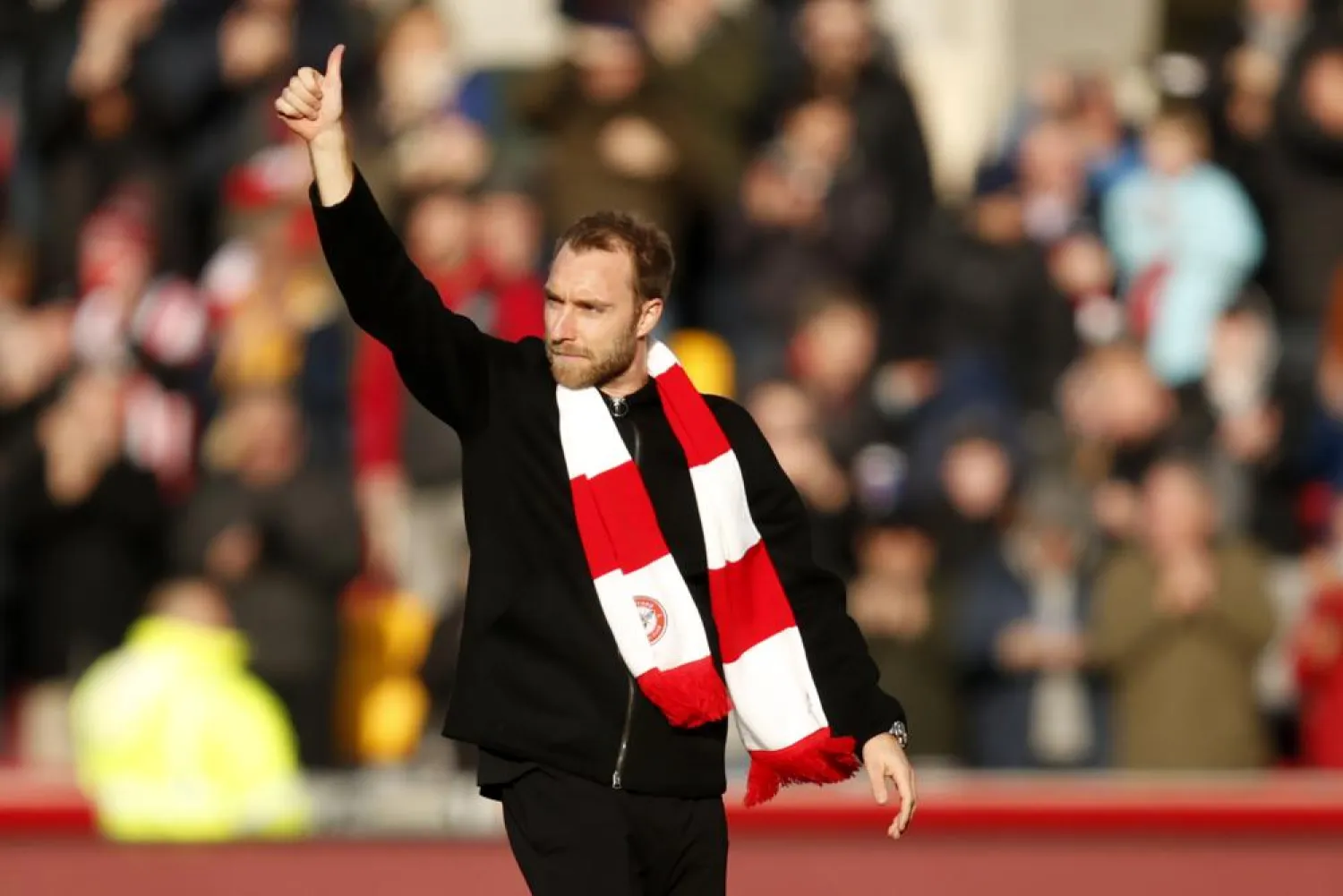 Brentford's Christian Eriksen gestures as he walks in the field ahead of the English Premier League match between Brentford and Crystal Palace at Brentford Community stadium in London, Saturday, Feb. 12, 2022. (AP)