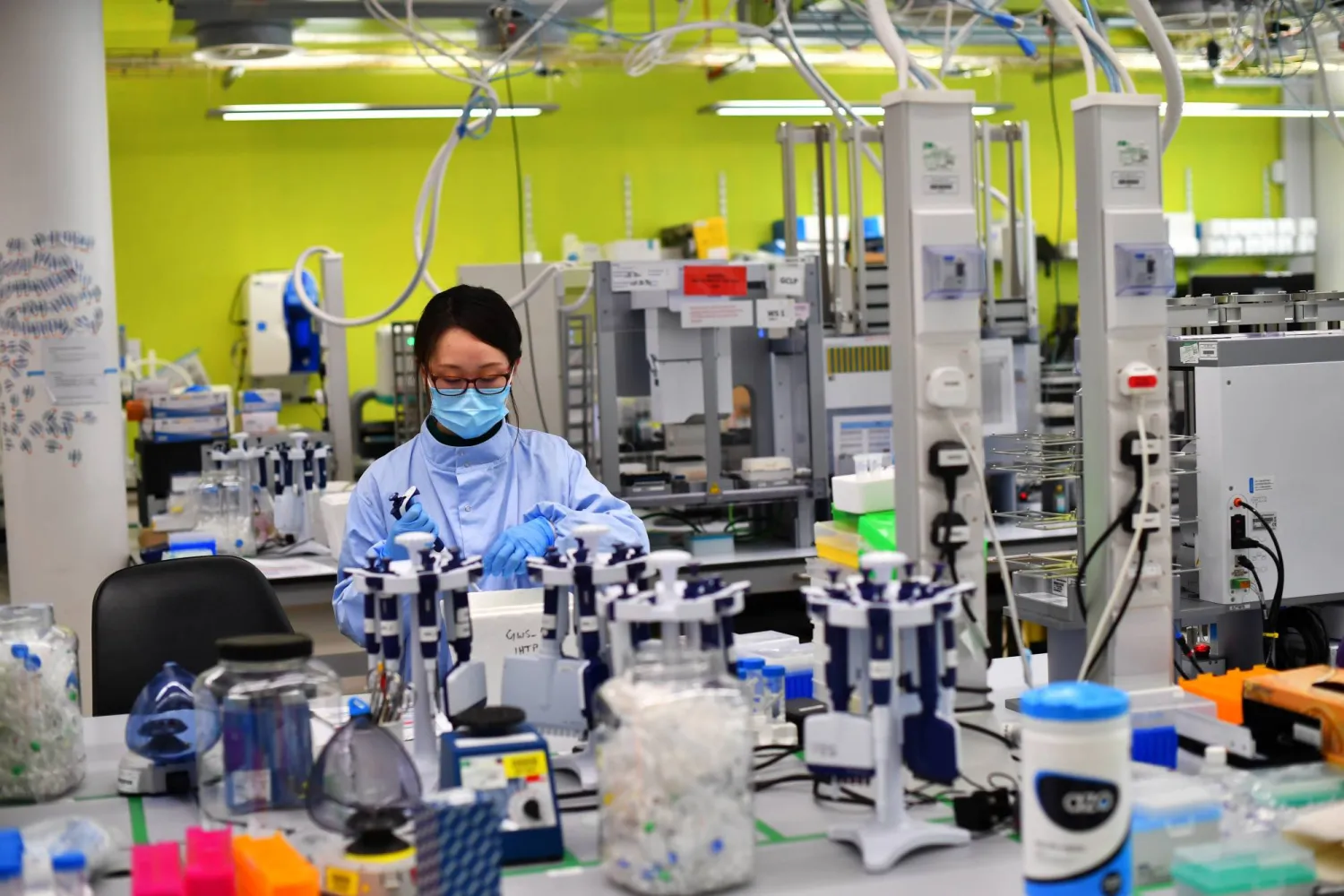  Scientists work at a laboratory on the Wellcome Sanger
Institute's campus south of Cambridge, England. | REUTERS