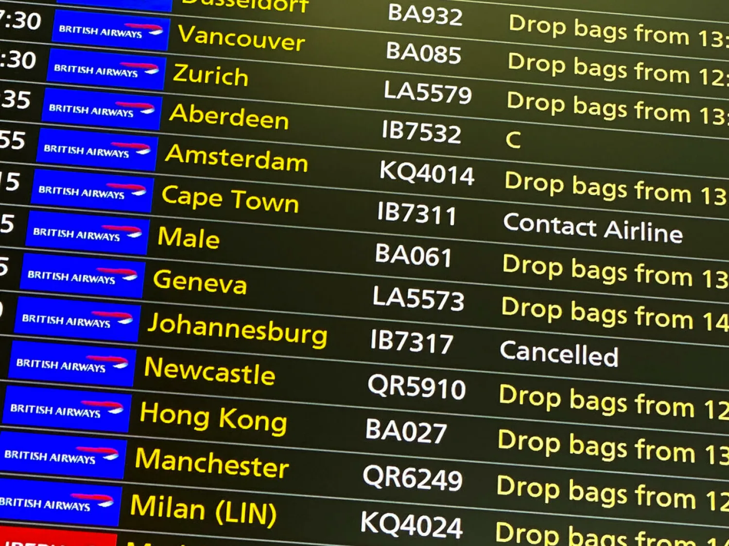 File Photo: A departures screen displays a cancelled flight to Johannesburg and a message to contact the airline for a scheduled flight to Capetown at London's Heathrow Airport on November 26, 2021. Alberto Pezzali, AP
