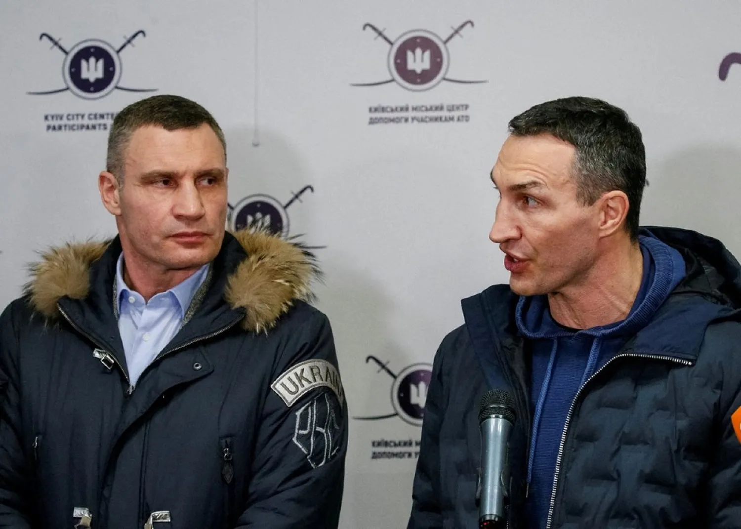Ukrainian heavyweight boxing world champion Wladimir Klitschko who joined the Ukrainian Territorial Defense Forces and his brother, Mayor of Kyiv and former heavyweight boxing champion Vitaly Klitschko, speak with journalists during the opening of the first Ukrainian Territorial Defense Forces recruitment center in central Kyiv, Ukraine, February 2, 2022. (Reuters)