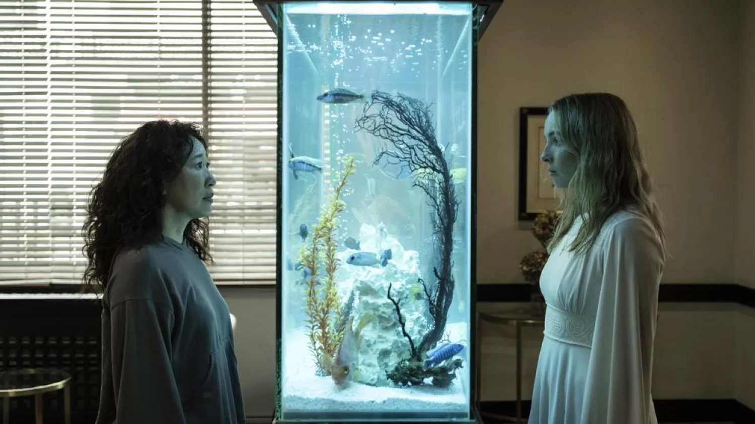 This image released by BBC America shows Sandra Oh, left, and Jodie Comer in a scene from the final season of "Killing Eve," premiering Sunday on BBC America and the AMC+ streaming service. (BBC America via AP)