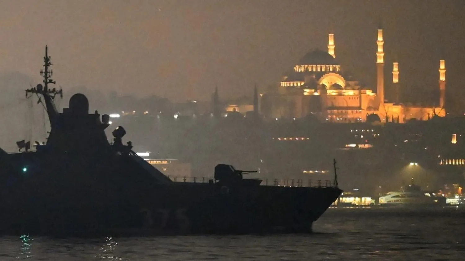 Russian Navy's Project 22160 Patrol Vessel Dmitriy Rogachev 375 sails through the Bosphorus Strait on the way to the Black Sea past Istanbul's Suleymaniye mosque in the backround on February 16, 2022 (AFP)