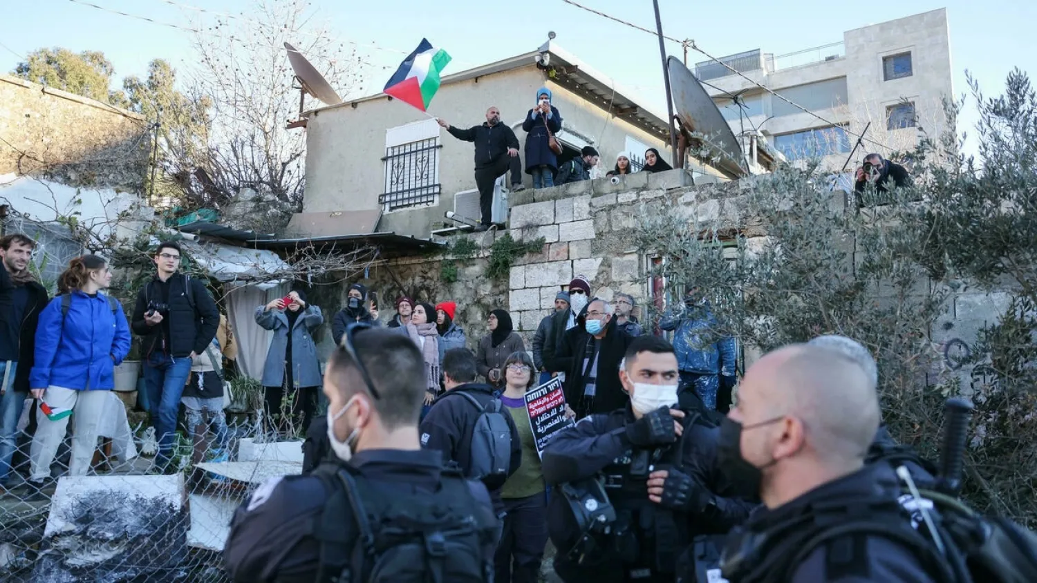Sheikh Jarrah has become a symbol of Palestinian resistance against Israeli control of Jerusalem; this photo taken on January 21, 2022 shows Israeli security forces deployed as Palestinian, Israeli, and foreign activists demonstrate. (AFP)