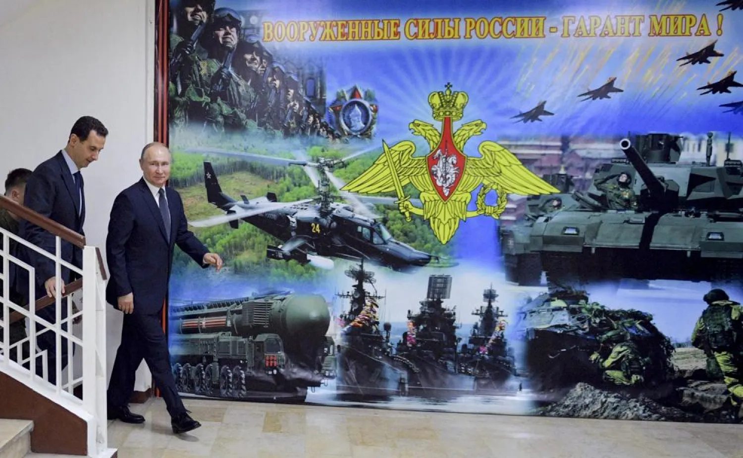 Syrian President Bashar Assad, left, gestures while speaking to Russian President Vladimir Putin during their meeting in Damascus, Syria, Jan. 7, 2020. (Sputnik, Kremlin Pool Photo via AP, File)