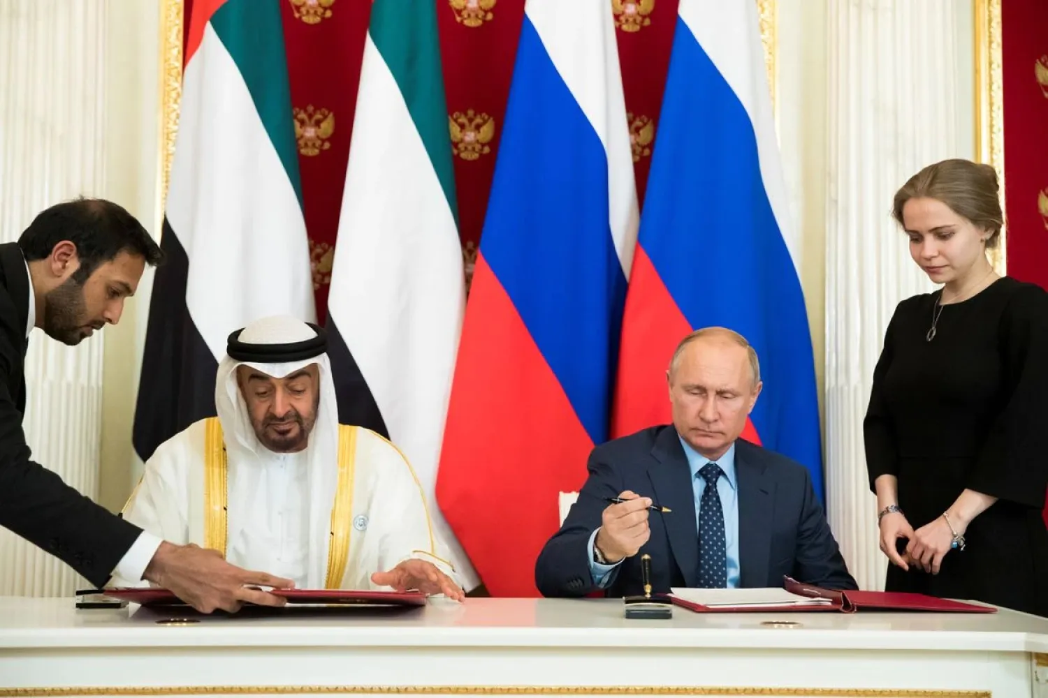 Russian President Vladimir Putin (2nd R) and Abu Dhabi's Crown Prince Sheikh Mohammed bin Zayed Al Nahyan (2nd L) of the United Arab Emirates attend a signing ceremony following the talks at the Kremlin in Moscow, Russia June 1, 2018. (Reuters)