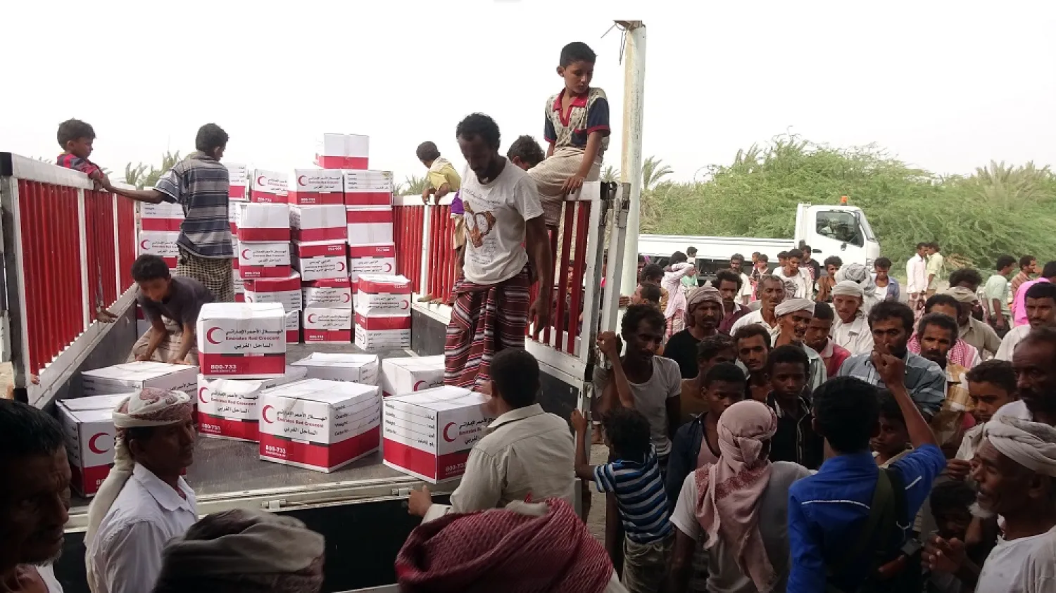 Yemenis drop off boxes of humanitarian aid in Hodeidah. (Getty Images)